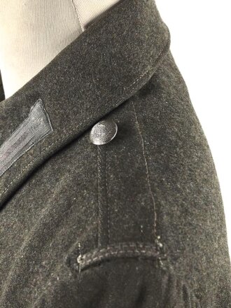 Heer, Feldbluse für Mannschaften Modell 1944. Getragenes Stück , die Effekten original vernäht