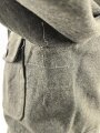 Heer, Feldbluse für Mannschaften Modell 1944. Getragenes Stück , die Effekten original vernäht