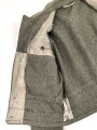 Heer, Feldbluse für Mannschaften Modell 1944. Getragenes Stück , die Effekten original vernäht