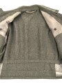 Heer, Feldbluse für Mannschaften Modell 1944. Getragenes Stück , die Effekten original vernäht