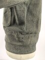 Heer, Feldbluse für Mannschaften Modell 1944. Getragenes Stück , die Effekten original vernäht