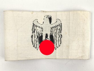 Armbinde für Zivilangestellte der Wehrmacht, dazu ein Foto