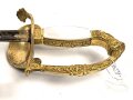 Bayern, Degen für Staatsbeamte. Ausführung mit gekröntem Monogramm " M " für König Maximilian II. (1848-1864) . Die Klinge beidseitig gebläut, leicht verputzt. Hersteller "R.Knecht in Solingen "