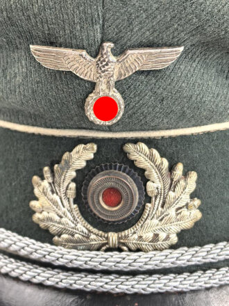 Reichswehr / frühe Wehrmacht, Schirmmütze für einen Offizier der Infanterie. Gestragenes Stück, Kopfgrösse 56