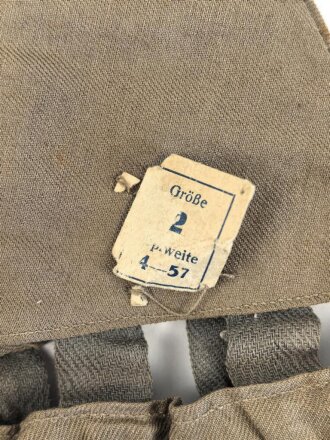 1.Weltkrieg, feldgrauer Überzug für eine Pickelhaube für Offiziere. Ungetragenes Stück mit Papieretikett