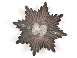 Emblem  Buntmetall versilbert. Maximale Breite knapp 12cm, Abstand der Splinte etwa 70mm