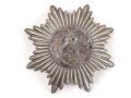 Emblem  Buntmetall versilbert. Maximale Breite knapp 12cm, Abstand der Splinte etwa 70mm