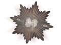 Emblem  Buntmetall versilbert. Maximale Breite knapp 12cm, Abstand der Splinte etwa 70mm