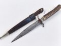 1.Weltkrieg  Grabendolch. Eigentumstück mit Hirschhorngriffschalen und Lederscheide. Guter Gesamtzustand