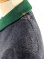 Uniformjacke dunkelblaugrau, erinnert vom Schnitt an Österreich, allerdings will der Kragen nicht dazu passen. Wenige kleinere Mottenschäden, sonst gut