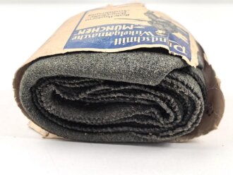 1.Weltkrieg " Rundschnitt Wickelgamasche München" mit der originalen Umverpackung einen feldgrauen Angehörigen der Gebirgstruppe darstellend.