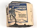 1.Weltkrieg " Rundschnitt Wickelgamasche München" mit der originalen Umverpackung einen feldgrauen Angehörigen der Gebirgstruppe darstellend.
