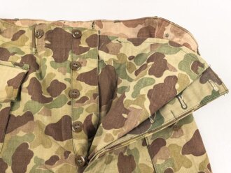 U.S. Army, 1943 dated Camo HBT combat trousers. Unissued, legs cut down, missing labels