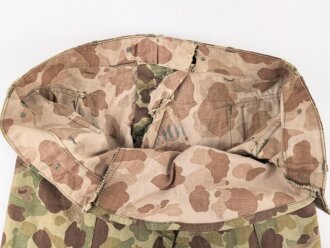 U.S. Army, 1943 dated Camo HBT combat trousers. Unissued, legs cut down, missing labels