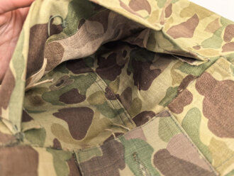 U.S. Army, 1943 dated Camo HBT combat trousers. Unissued, legs cut down, missing labels