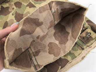 U.S. Army, 1943 dated Camo HBT combat trousers. Unissued, legs cut down, missing labels
