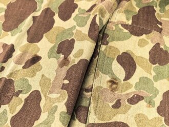 U.S. Army, 1943 dated Camo HBT combat trousers. Unissued, legs cut down, missing labels