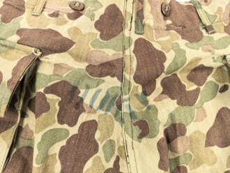 U.S. Army, 1943 dated Camo HBT combat trousers. Unissued, legs cut down, missing labels