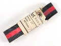 Bündel Ordensband zur Anschlussmedaille 1.Oktober 1938. Breite 30mm. In der originalen Banderole, laut dieser 10 Meter