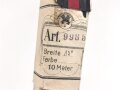 Bündel Ordensband zur Anschlussmedaille 1.Oktober 1938. Breite 30mm. In der originalen Banderole, laut dieser 10 Meter