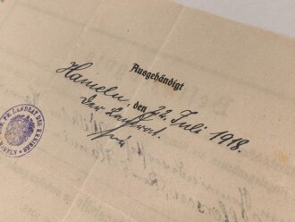 Preussen, Verleihungsurkunde zum Verdienstkreuz für Kriegshilfe, ausgestellt auf einen Gemeidevorsteher am 3.Juni 1918. Mehrfach gefaltet, dazu das Verdienstkreuz am Band