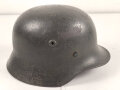 Stahlhelm Modell 1940 für Angehörige des Heeres. In allen Teilen original und zusammengehörig, undeutlich gestempelt ? 64.