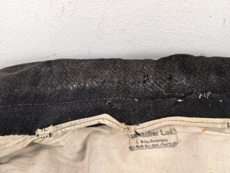 1.Weltkrieg Württemberg, Ersatzmantel aus schwarzem Tuch ( sogenannter Landsturmmantel) so 1914/15 in ermangelung feldgrauer Mäntel ausgegeben. Kammerstück I.R. 125, Wäscheetikett eines Angehörigen im Ers. Batl. Res, Infanterie Regiment 119 .