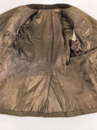 Dienstrock für Angehörige im NS Kraftfahrkorps NSKK. Das Schulterstück originalvernäht, RZM Etikett in der Tasche. Ungereinigt