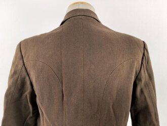 Dienstrock für Angehörige in der SA? Relativ dunkles braun, verwaschenes Etikett in der Tasche. Mottenschäden, ungereinigt