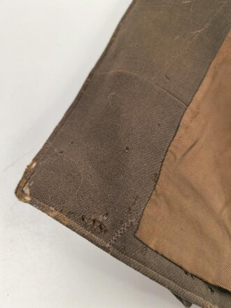 Dienstrock für Angehörige in der SA? Relativ dunkles braun, verwaschenes Etikett in der Tasche. Mottenschäden, ungereinigt
