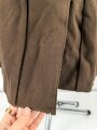 Dienstrock für Angehörige in der SA? Relativ dunkles braun, verwaschenes Etikett in der Tasche. Mottenschäden, ungereinigt