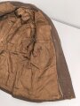 Dienstrock für Angehörige in der SA? Relativ dunkles braun, verwaschenes Etikett in der Tasche. Mottenschäden, ungereinigt