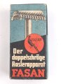 "FASAN" Rasierapparat aus weißer Preßmasse. Ungebraucht, in der originalen Umverpackung, diese leicht zerdrückt