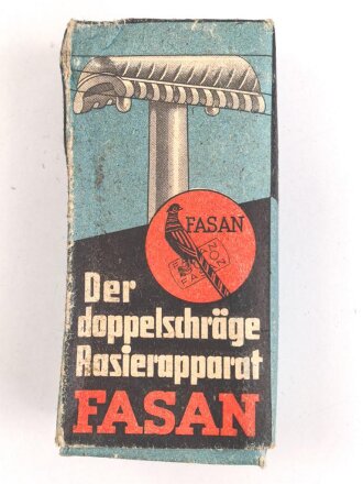 "FASAN" Rasierapparat aus weißer Preßmasse. Ungebraucht, in der originalen Umverpackung, diese leicht zerdrückt