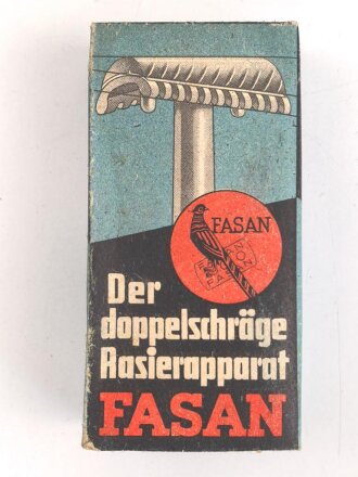 "FASAN" Rasierapparat aus weißer Preßmasse. Ungebraucht, in der originalen Umverpackung, diese leicht zerdrückt