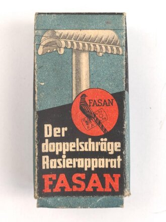 "FASAN" Rasierapparat aus weißer Preßmasse. Ungebraucht, in der originalen Umverpackung, diese leicht zerdrückt