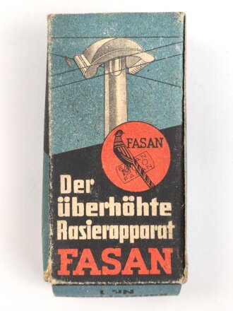 "FASAN" Rasierapparat aus weißer Preßmasse. Ungebraucht, in der originalen Umverpackung, diese leicht zerdrückt
