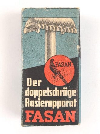 "FASAN" Rasierapparat aus weißer Preßmasse. Ungebraucht, in der originalen Umverpackung, diese leicht zerdrückt