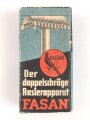 "FASAN" Rasierapparat aus weißer Preßmasse. Ungebraucht, in der originalen Umverpackung, diese leicht zerdrückt