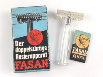 "FASAN" Rasierapparat aus transparenter Preßmasse. Ungebraucht, in der originalen Umverpackung, diese leicht zerdrückt