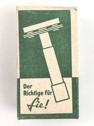 "Rogerit" Rasierapparat aus brauner Preßmasse. Ungebraucht, in der originalen Umverpackung, diese leicht zerdrückt