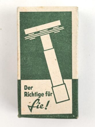 "Rogerit" Rasierapparat aus brauner Preßmasse. Ungebraucht, in der originalen Umverpackung, diese leicht zerdrückt