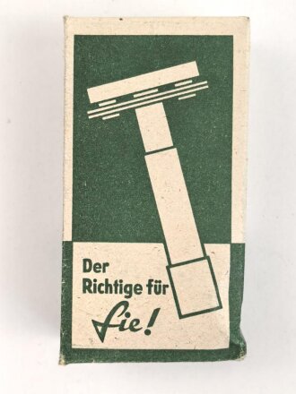 "Rogerit" Rasierapparat aus brauner Preßmasse. Ungebraucht, in der originalen Umverpackung, diese leicht zerdrückt