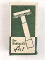 "Rogerit" Rasierapparat aus brauner Preßmasse. Ungebraucht, in der originalen Umverpackung, diese leicht zerdrückt