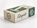 "Rogerit" Rasierapparat aus brauner Preßmasse. Ungebraucht, in der originalen Umverpackung, diese leicht zerdrückt