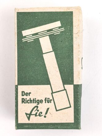 "Rogerit" Rasierapparat aus brauner Preßmasse. Ungebraucht, in der originalen Umverpackung, diese leicht zerdrückt