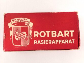 "Rogerit" Rasierapparat aus Metall. Ungebraucht, in der originalen Umverpackung, diese leicht zerdrückt