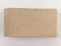 Rasierapparat aus brauner Preßmasse ohne Bezeichnung. Ungebraucht, in der originalen Umverpackung, diese leicht zerdrückt