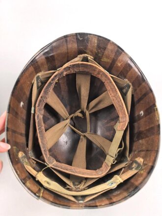 U.S. Army WWII Steel helmet.  Liner made by "Firestone"  All parts seem to have seen service after WWII as well.