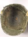U.S. Army WWII Steel helmet.  Liner made by "Firestone"  All parts seem to have seen service after WWII as well.